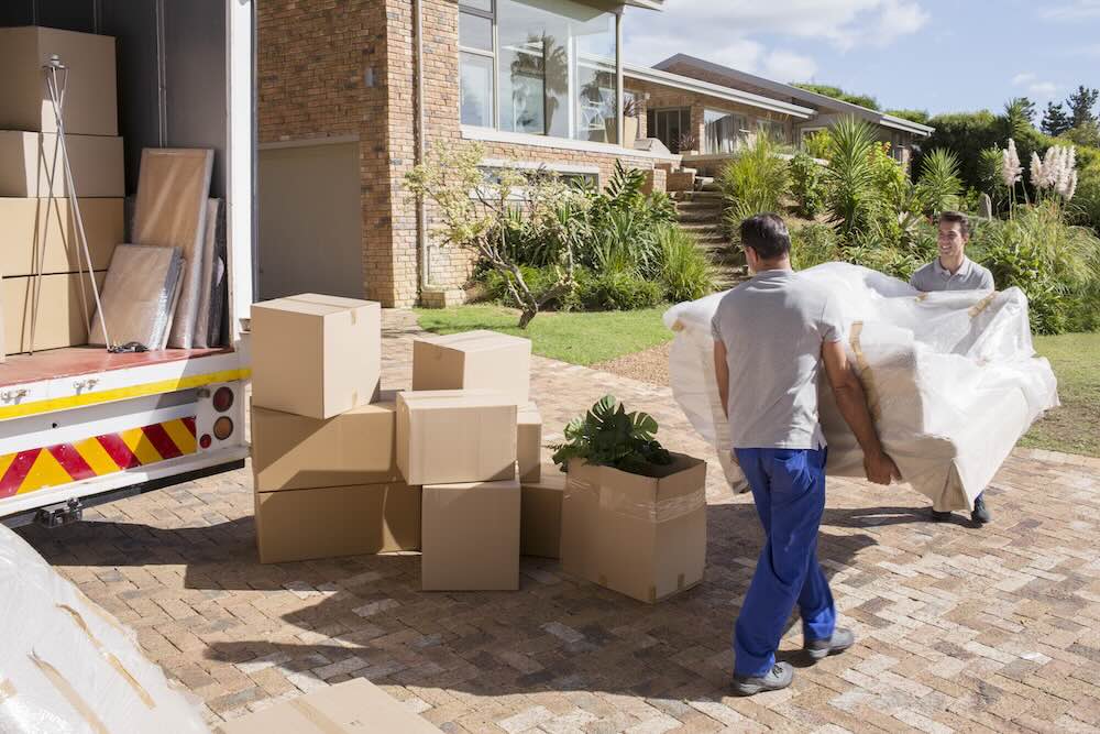 Insured removalists carrying furniture